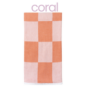 Checkered towel with coral and pink squares on a white background