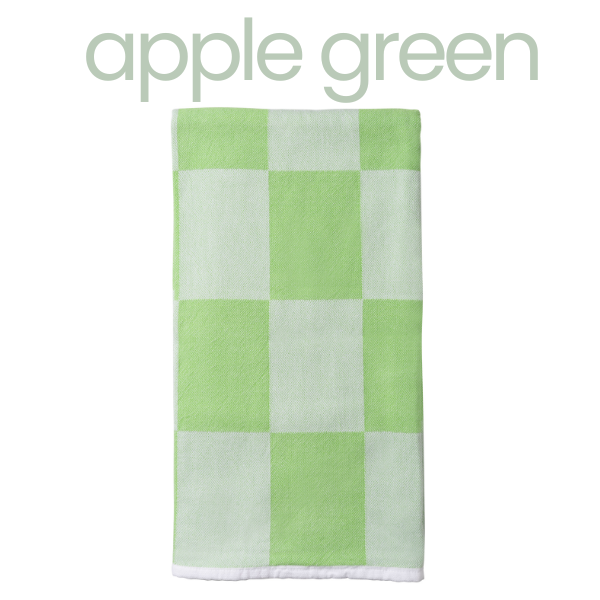 Checkered towel with green and white pattern on a white background